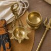 Brass souvenirs packed for Kandy Esala Perahera travellers including oil lamp punkalasa and trishula